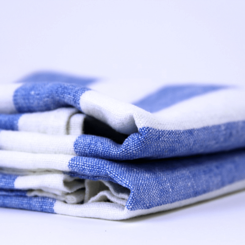 Linen Pool Towel stacked crop edge detail product shot in color White Light Blue Stripe by LinenCasa for South Hous.