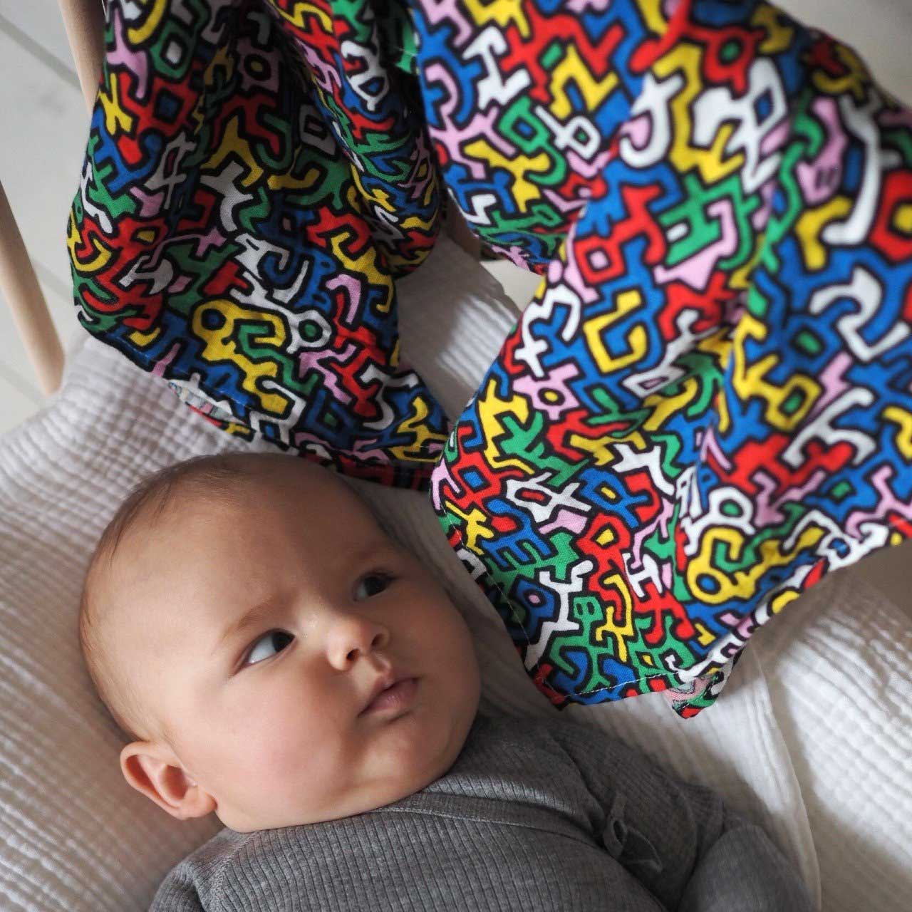 Keith Haring Pop Art Print Muslin Squares blanket lovey detail product shot in color Brazil Primary by Etta Loves for South Hous.