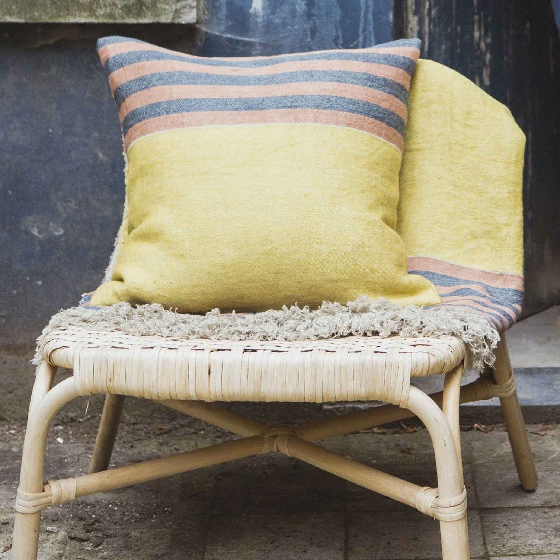 Belgian linen throw pillow cover lifestyle product shot in color Red Earth by Libeco for South Hous.