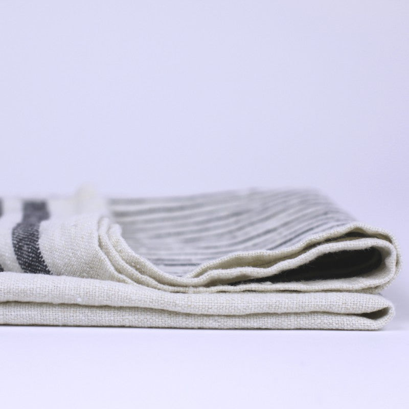 Linen Kitchen Towel crop edge detail product shot in color Antique White with Black Stripe by LinenCasa for South Hous.