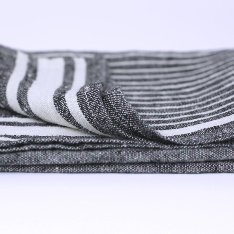 Linen Kitchen Towel flat lay fold edge detail product shot in color Black with White Stripe by LinenCasa for South Hous.