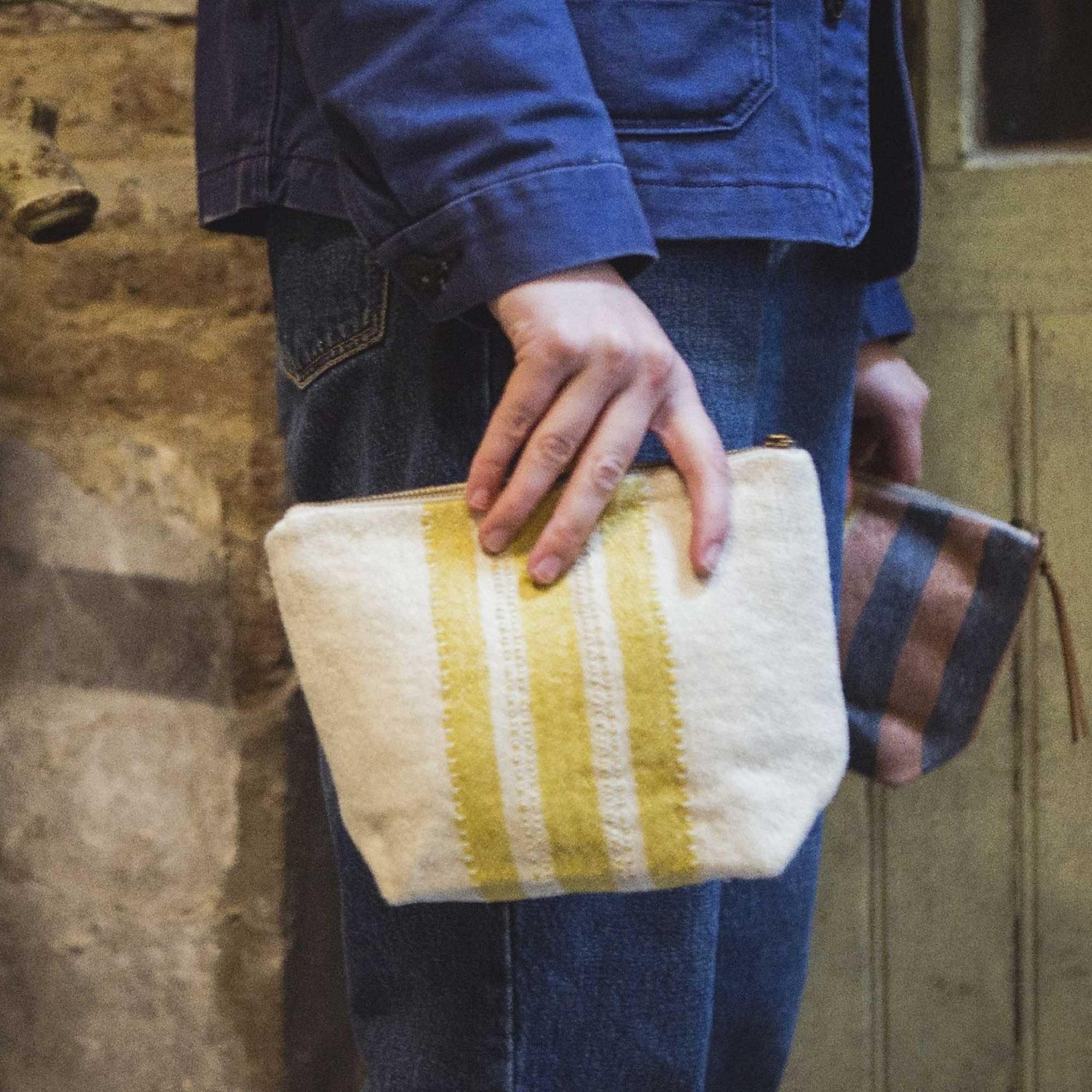 Belgian linen pouch lifestyle product shot in color Mustard Stripe by Libeco for South Hous.