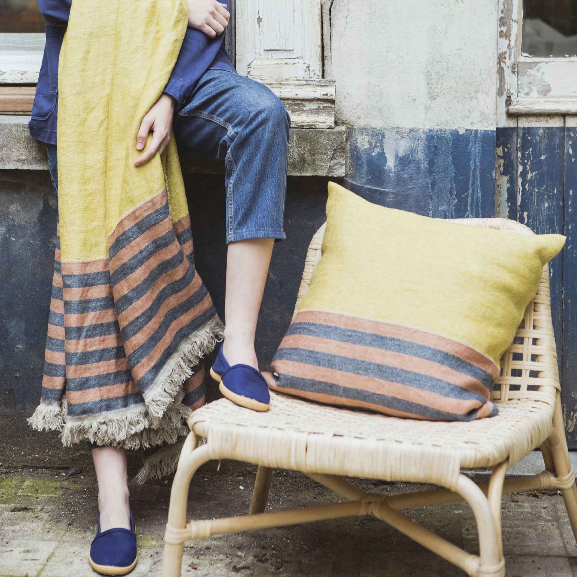 Belgian linen throw blanket and pillow cover set product shot in color Red Earth by Libeco for South Hous.