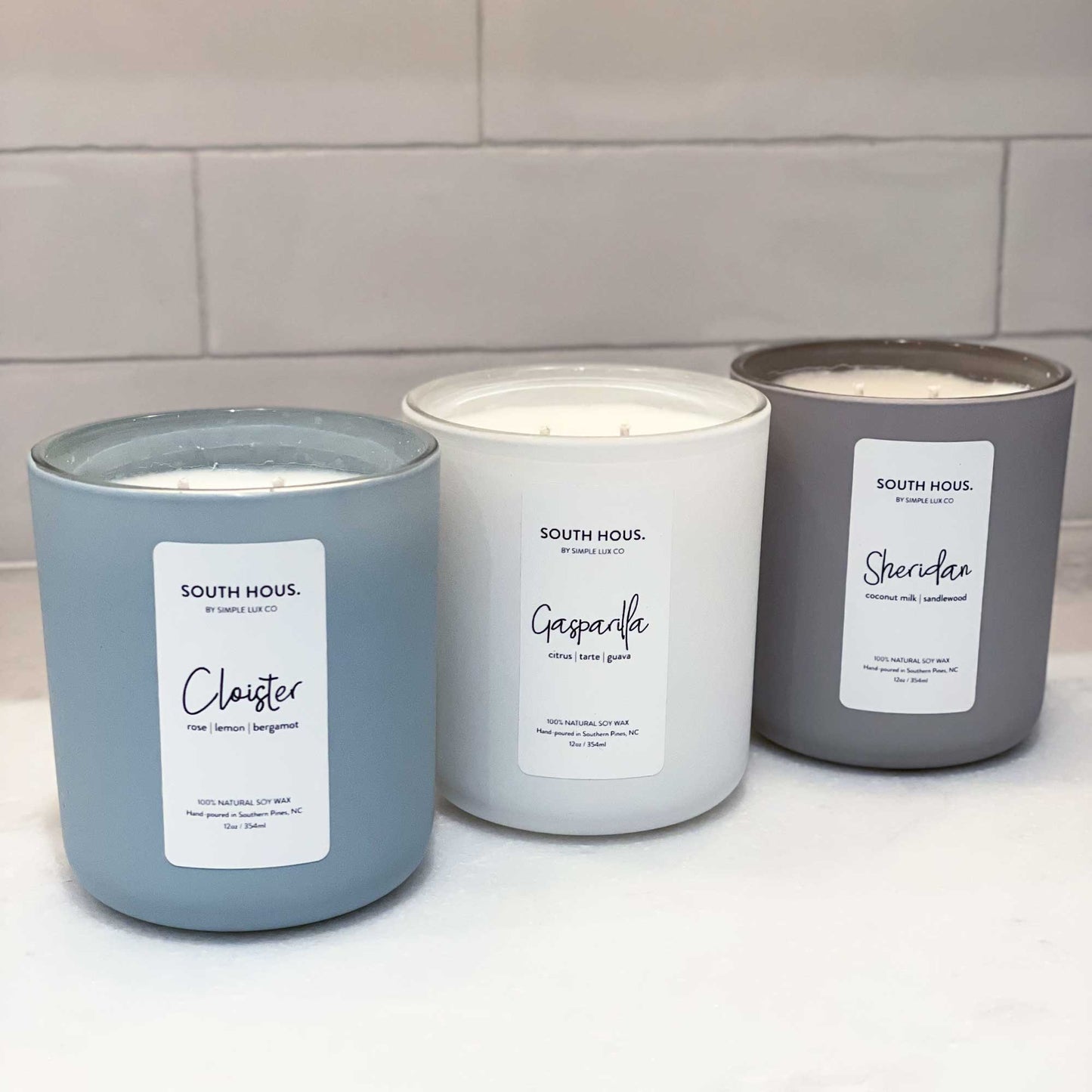South Hous Destination Candle lifestyle product lineup shot in Cloister Gasparilla Sheridan by Simple Lux Co for South Hous.