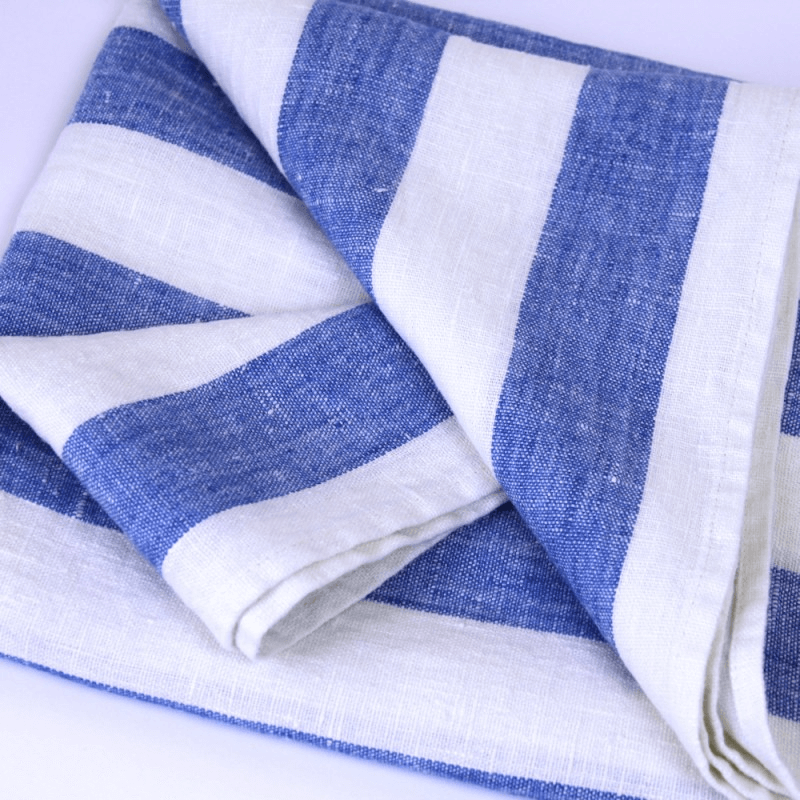 Linen Pool Towel flat lay fold detail product shot in color White Light Blue Stripe by LinenCasa for South Hous.