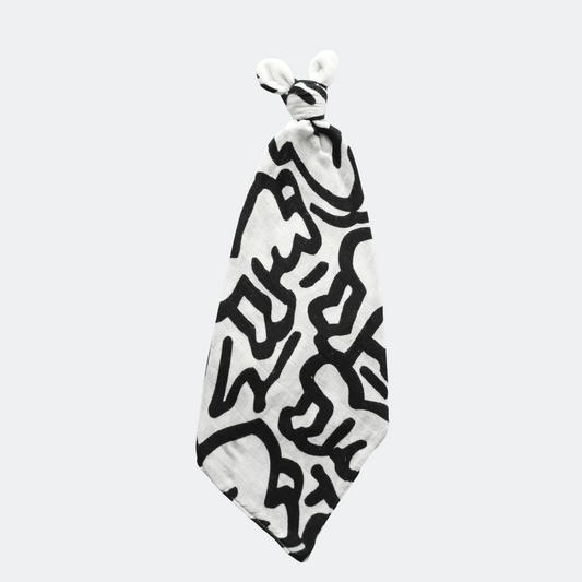 Keith Haring Print Baby Lovey flat lay product shot in color black and white by Etta Loves for South Hous.