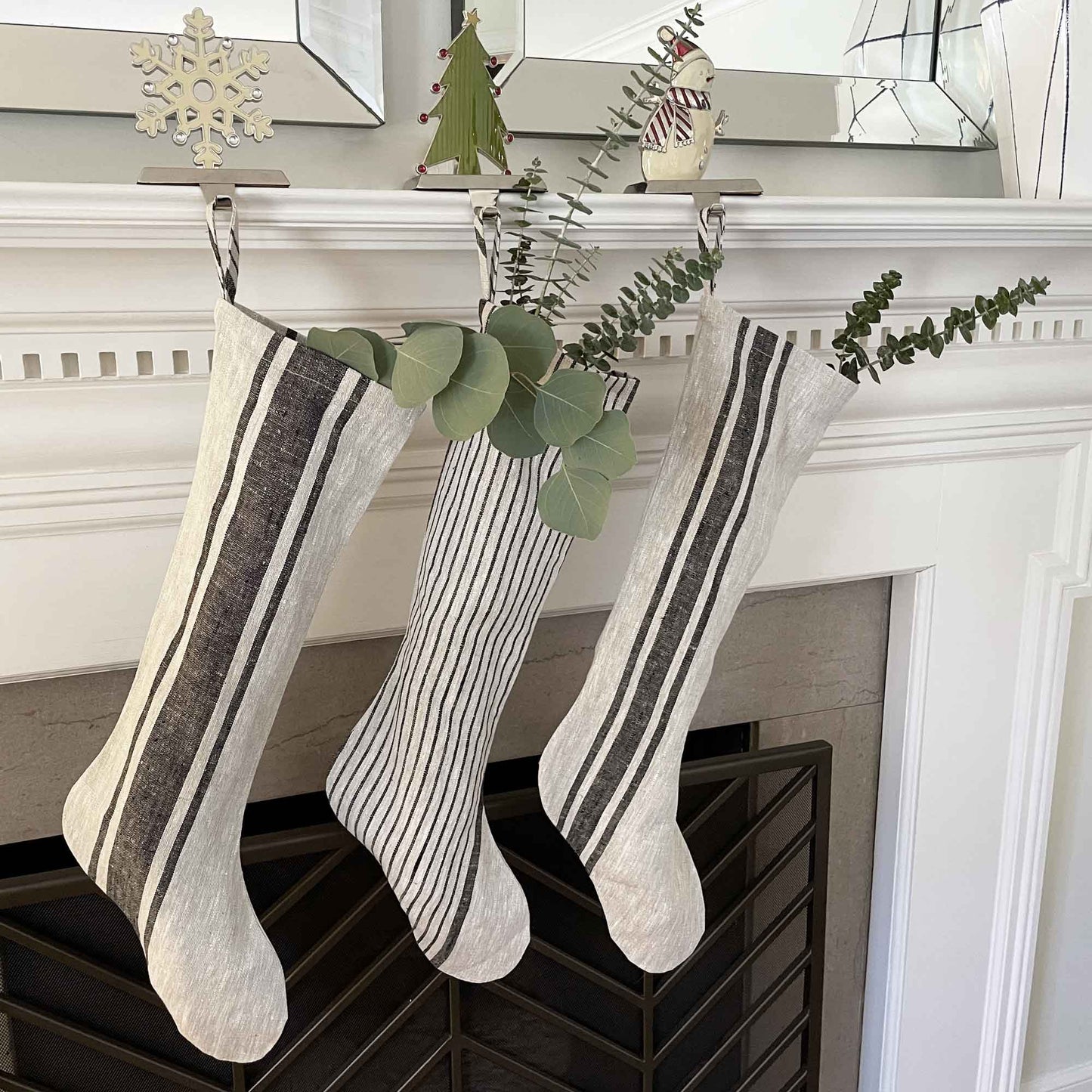 South Hous Scandinavian style Linen Holiday Stockings lifestyle product lineup shot in medium wide pin stripe.