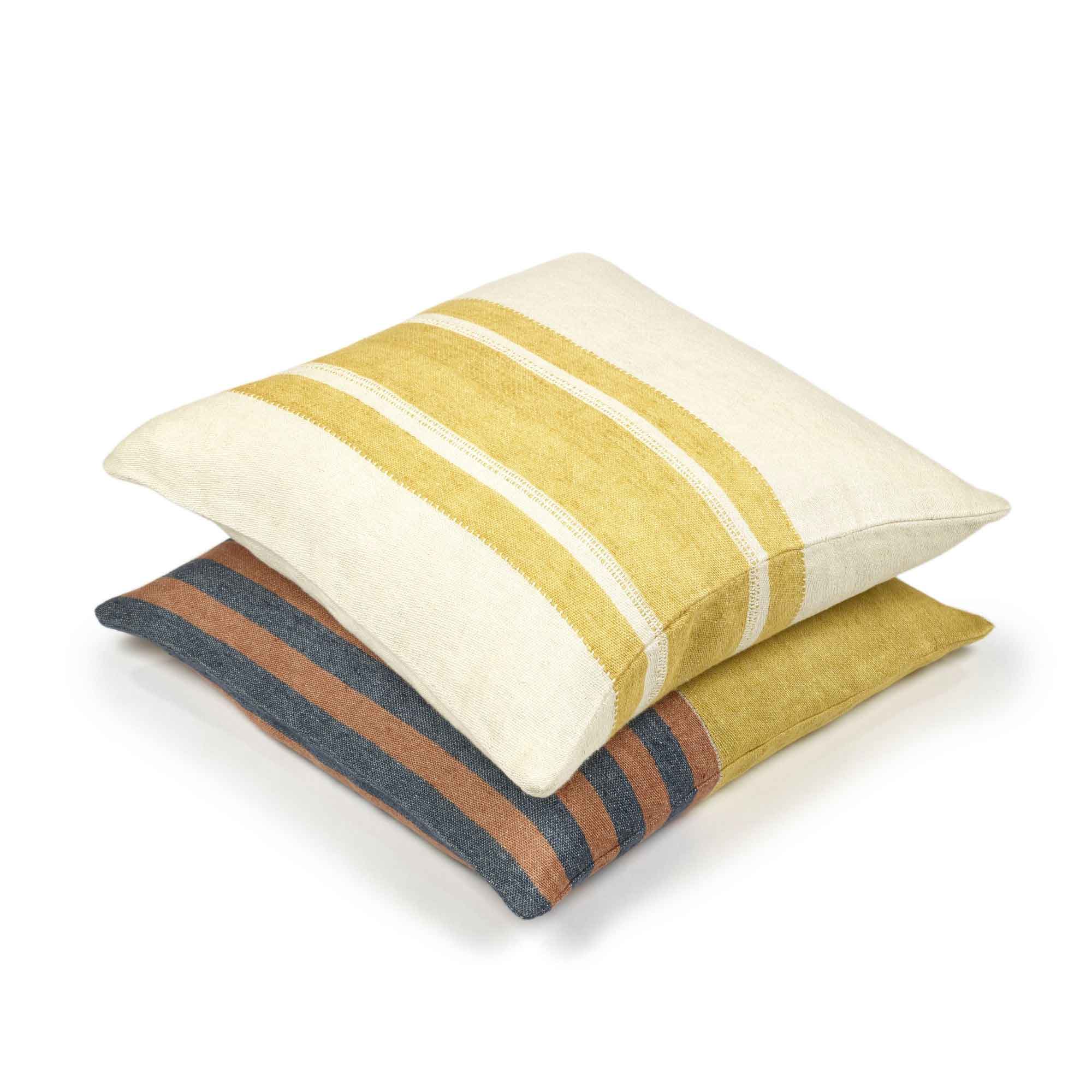 Belgian linen throw pillow covers stacked in colors Mustard Stripe and Read Earth by Libeco for South Hous.