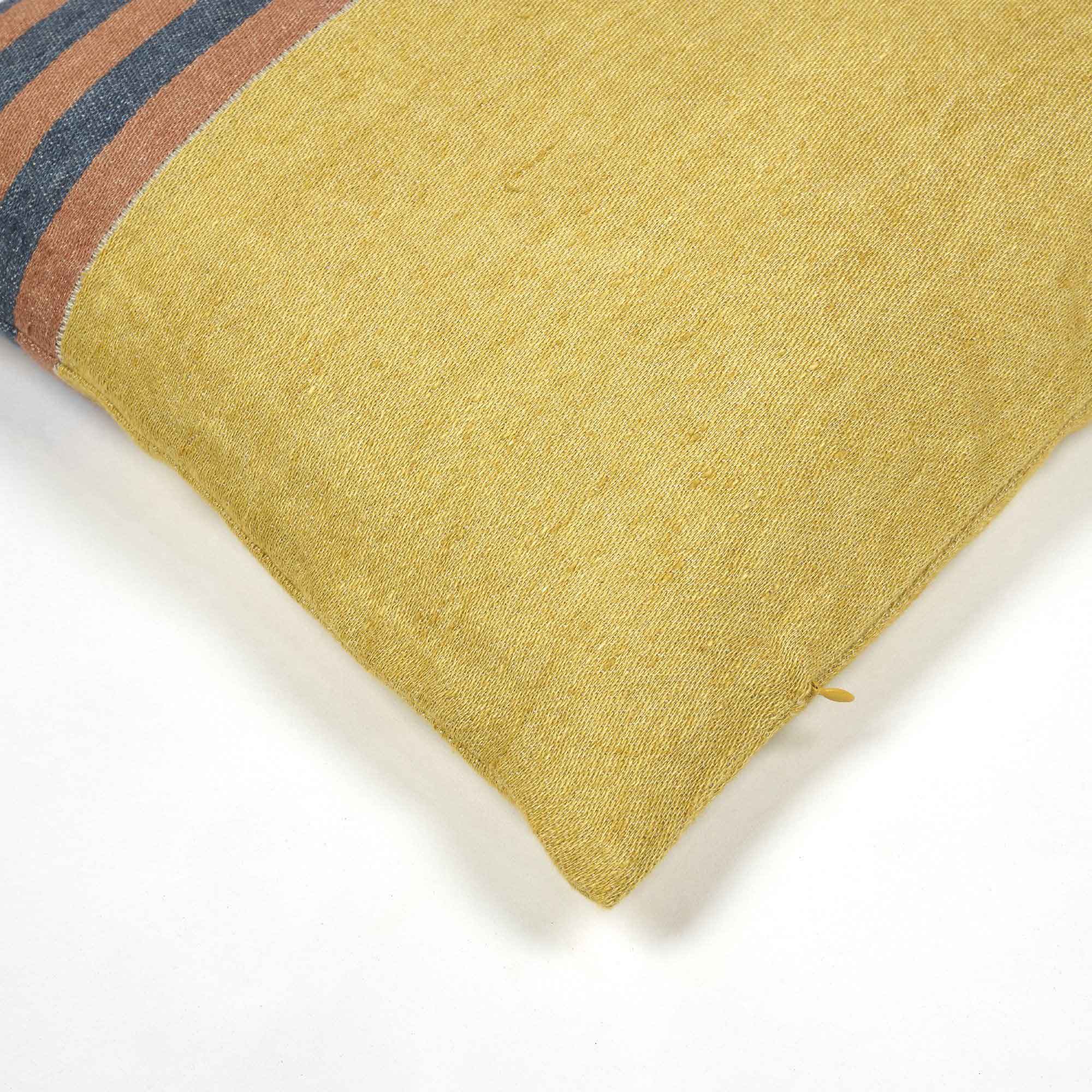 Belgian linen throw pillow cover corner detail shot in color Red Earth by Libeco for South Hous.