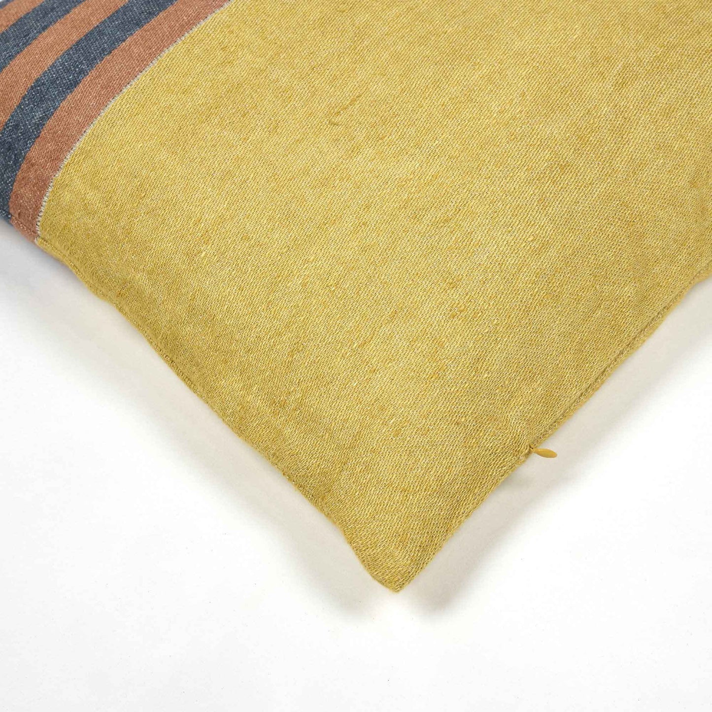 Belgian linen throw pillow cover corner detail shot in color Red Earth by Libeco for South Hous.
